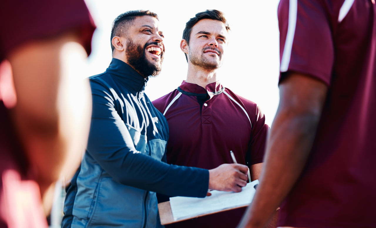 Coaching, rugby or happy man writing with a strategy, planning or training progress with a game formation. Leadership, mission or funny guy with sports men or athlete group for fitness or team goals; Shutterstock ID 2264932909; purchase_order: POIIG0004097; job: OMG1193295; client: Danone UK; other: 480